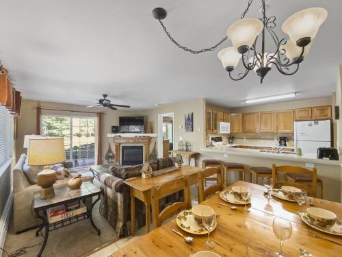 a kitchen and living room with a table and a couch at Swans Nest Villa 1304 condo in Breckenridge