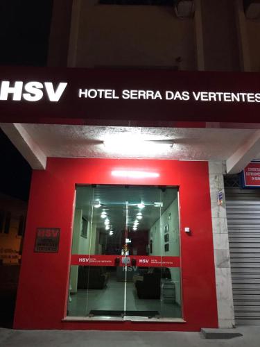 a hotel serra da las veritas sign on a building at Hotel Serra Das Vertentes in Barbacena