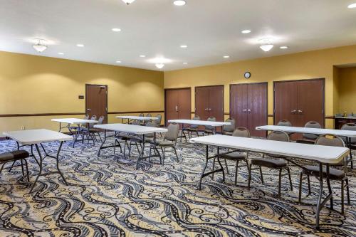 a conference room with tables and chairs in it at Comfort Suites Jonesboro University Area in Jonesboro