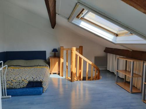 Ένα ή περισσότερα κρεβάτια σε δωμάτιο στο Beau duplex lumineux avec aperçu mer