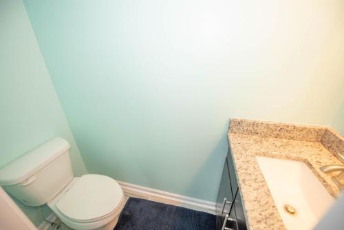 a bathroom with a toilet and a sink at campbellton B in Atlanta
