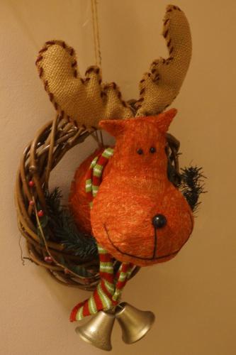 a christmas ornament of a reindeer on a wall at Corner Cottage - character, charm, great location. in Ringwood