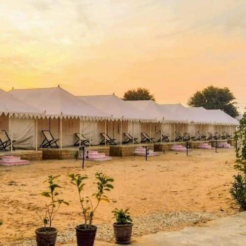 a large tent in the middle of a field at Excellent Desert Safari camp in Sām