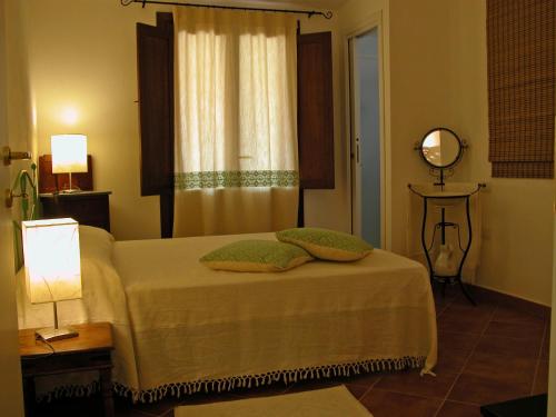 Postel nebo postele na pokoji v ubytování B&B L'Umbra di lu Soli