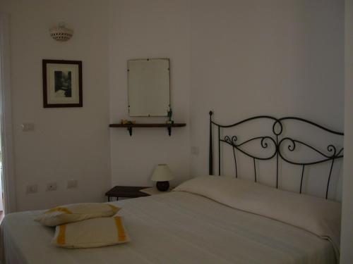 Postel nebo postele na pokoji v ubytování B&B L'Umbra di lu Soli