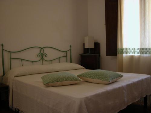 Postel nebo postele na pokoji v ubytování B&B L'Umbra di lu Soli