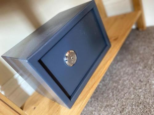 a blue box sitting on top of a table at Burlington Hotel in Sandown