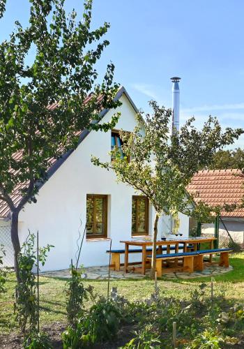 a house with a picnic table in front of it at Vinný sklípek Blatnice in Blatnice