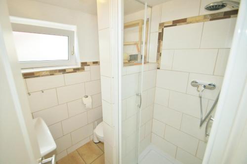 a bathroom with a shower and a toilet at Strandnelke in Dahme