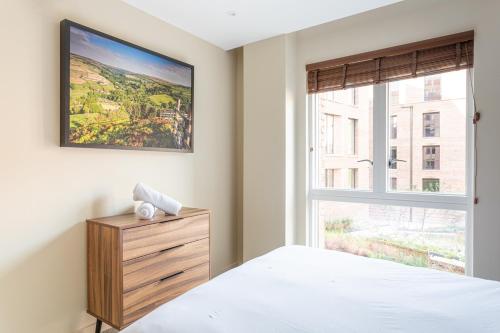 a bedroom with a bed and a window at Kings apartments, Hudson Quarter in York
