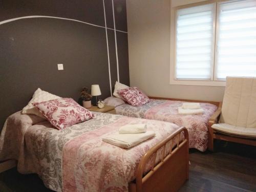 Postel nebo postele na pokoji v ubytování Aixula Lekeitio - Garaje opcional, reformado y céntrico