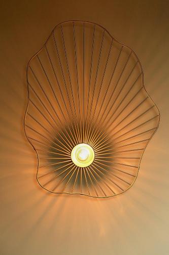 a ceiling light with a shell design at Ares Suites in Plataria
