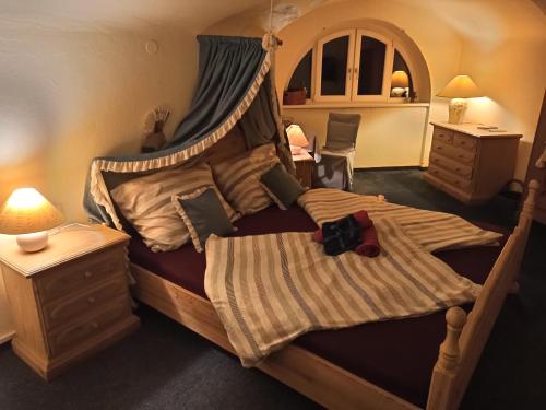 a bedroom with a large bed with a canopy at Villa Petterhof in Schottwien