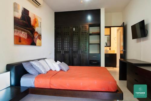 Ένα ή περισσότερα κρεβάτια σε δωμάτιο στο Yamanik Puerto Aventuras Condo