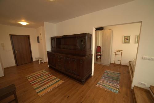 a room with a large wooden dresser in a room at Arena Penthouse Apartments in Belgrade