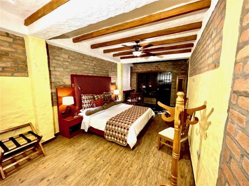 Una cama o camas en una habitación de Monasterio San Agustín, Colombia