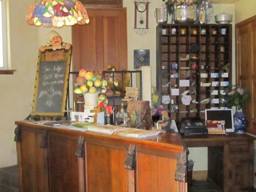 a counter in a room with a bunch of wine bottles at FLEUR DE LAC EUROPERAN INn in Lake Arrowhead