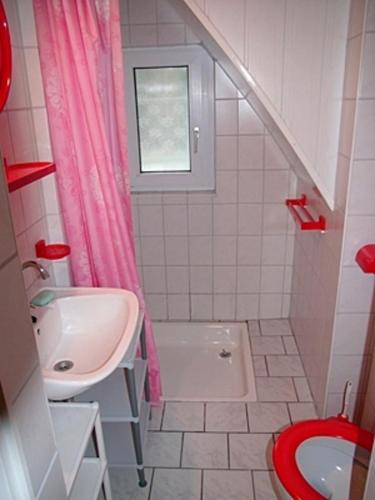 a small bathroom with a sink and a toilet at Tabbert, Kerstin - 21697 in Zingst