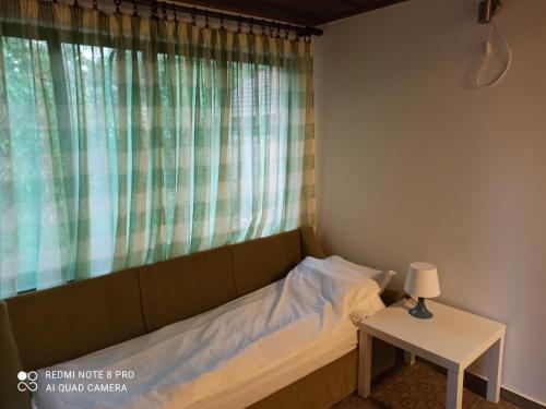 Кровать или кровати в номере Apartmani Lina