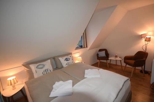 Ένα ή περισσότερα κρεβάτια σε δωμάτιο στο Ostseebrise FH 3