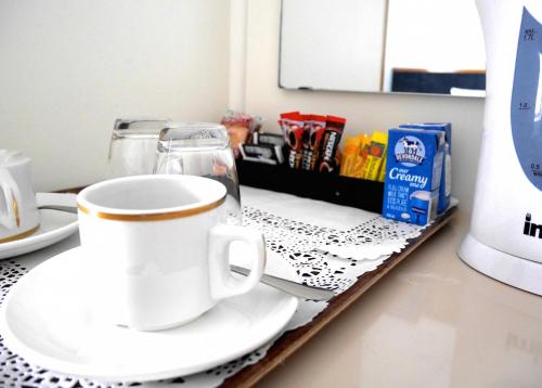 a coffee cup sitting on a counter in a bathroom at Pedder Wilderness Lodge in Strathgordon