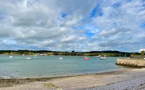 a group of boats in a body of water at Garddfon Inn in Y Felinheli