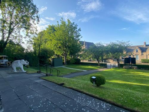 a statue of a polar bear in a park at No6 West Coates in Edinburgh