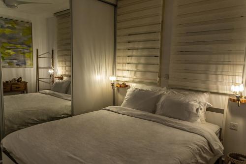 Voodi või voodid majutusasutuse Garden Suite & Pool toas