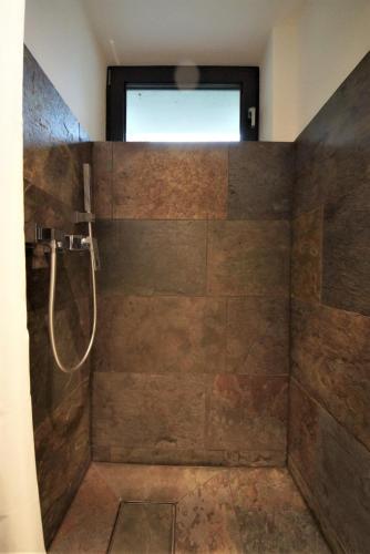 a bathroom with a shower with a window at Ruhe Oase mit tollem Fernblick inmitten der Natur in Limbach