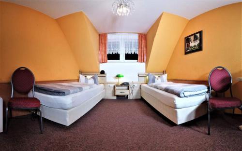 Ein Bett oder Betten in einem Zimmer der Unterkunft Hotel Garden