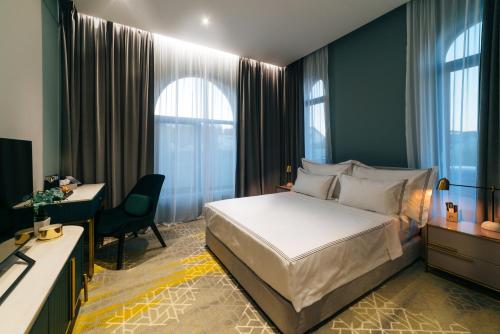 מיטה או מיטות בחדר ב-ARN Boutique Hotel