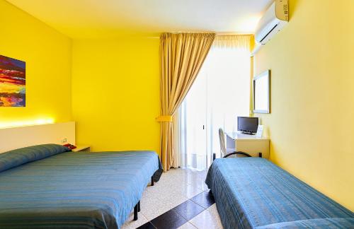 Voodi või voodid majutusasutuse Hotel Club Clorinda nuova gestione 2024 toas