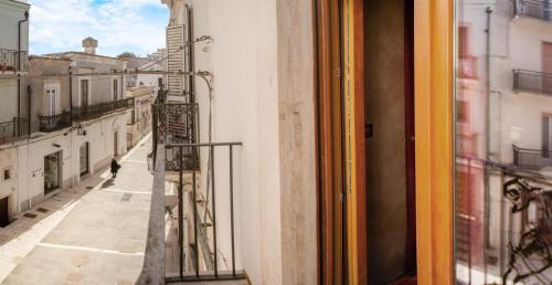 a view of a street from a window at Rooms Gli Arcangeli - Affitti Brevi Italia in Monte SantʼAngelo