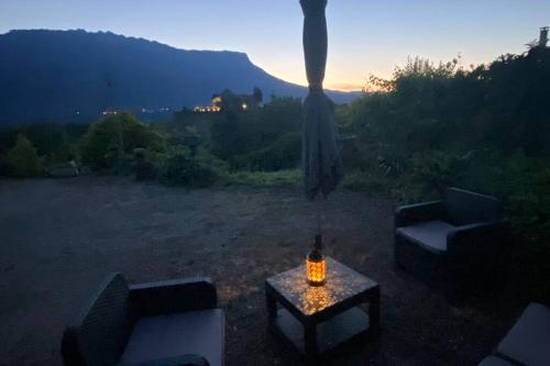 a table with a candle on top of a field at Au calme avec vue magnifique à Saint Maximin in Saint-Maximin