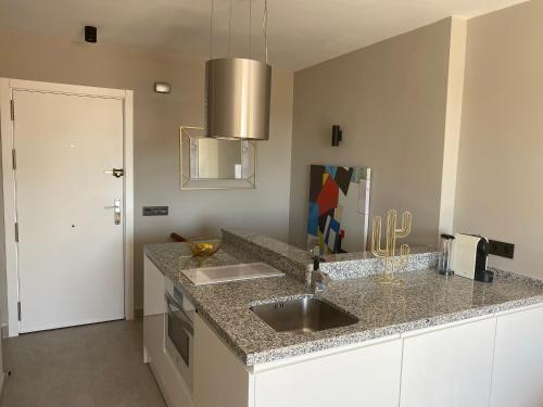 a kitchen with a sink and a counter top at Ocean view, Luxury & Relax Dunas de Artola in Marbella