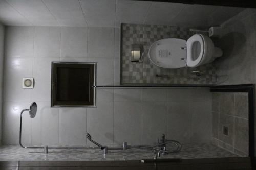 a bathroom with a shower and a sink and a mirror at Amazing one Bedroom Apartment in Amman Elwebdah 7 in Amman