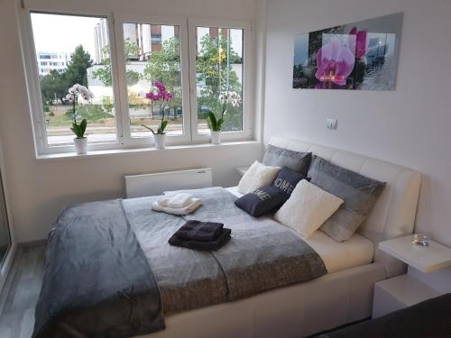 a bedroom with a bed with two pillows on it at Apartment VAL in Koper