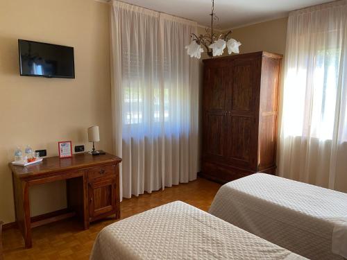 Postel nebo postele na pokoji v ubytování La Via del Sole