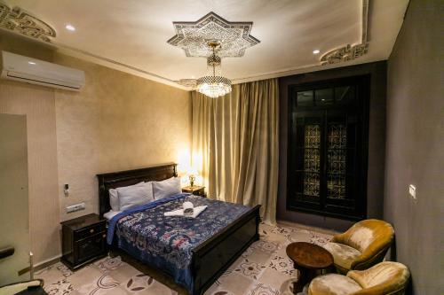 Postel nebo postele na pokoji v ubytování Palais Shazam & SPA