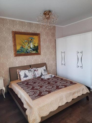 Ένα ή περισσότερα κρεβάτια σε δωμάτιο στο Home Odessa