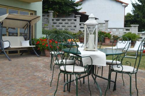 a table and chairs sitting on a brick patio at Profumi... in Vinchio
