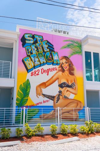 a building with a large billboard of a woman on it at The Saint Hotel in St Pete Beach