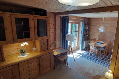 a kitchen with a table and a dining room at Urlaub mit Aussicht in Pfarrwerfen