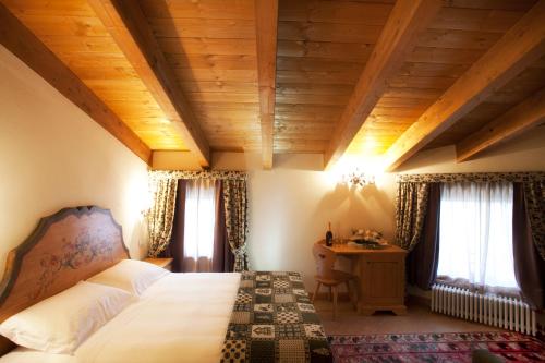 Postel nebo postele na pokoji v ubytování Garnì Astoria Hotel & SPA