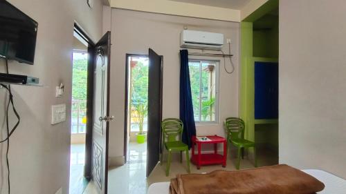 TV a/nebo společenská místnost v ubytování Green Earth Resort