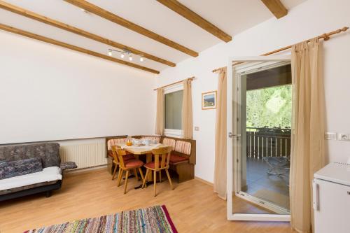 a living room with a table and a couch at Appartement Sonneck in Lappago