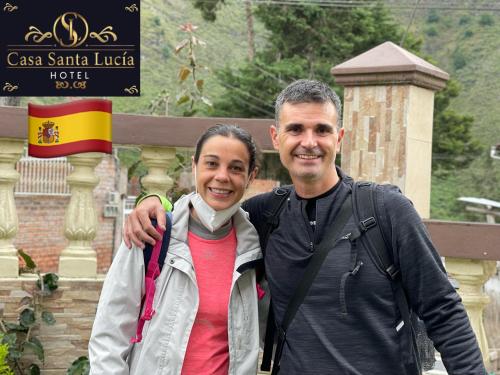 a man and a woman posing for a picture at Hotel Casa Santa Lucía in Baños