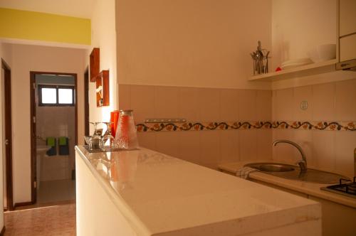 a kitchen with a counter top and a sink at Misturod - Holiday Apartments in Santa Maria