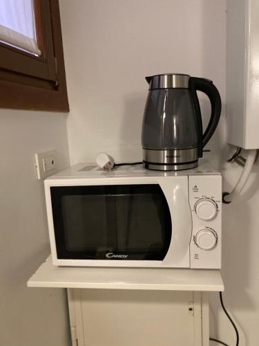 a microwave with a pot on top of it at Venice Venezia ,GHETTO,BIENNALE, Campo Maddalena in Venice
