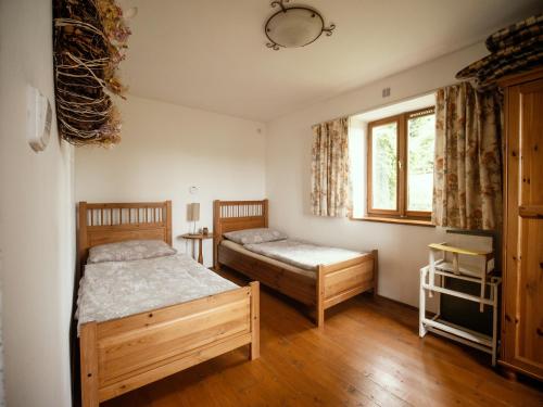 Postel nebo postele na pokoji v ubytování Cottage Bara